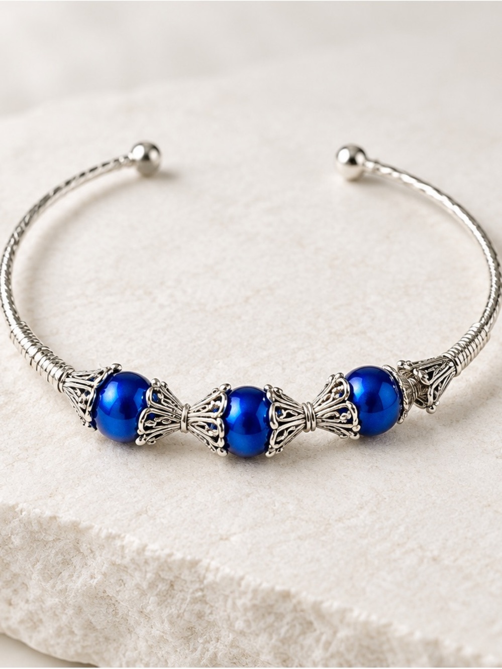 Artisan Handcrafted Silver Filigree Cuff Bracelet with Luminous Royal Blue Pearl